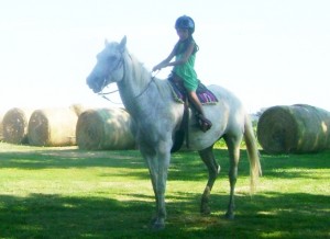 Madeline Riding Cricket at Age 6