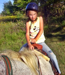 Madeline Riding Cricket at Age 7