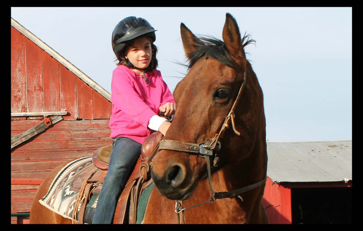 Madeline riding Red